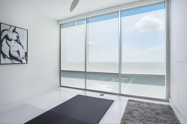 a bathroom with a glass shower door