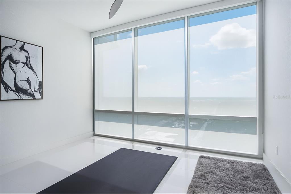 150 East Robinson Street, Unit 29B Orlando, FL 32801 - Photo 21 of 27 a bathroom with a glass shower door