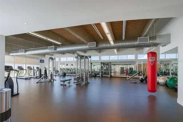 a view of a studio with wooden floor