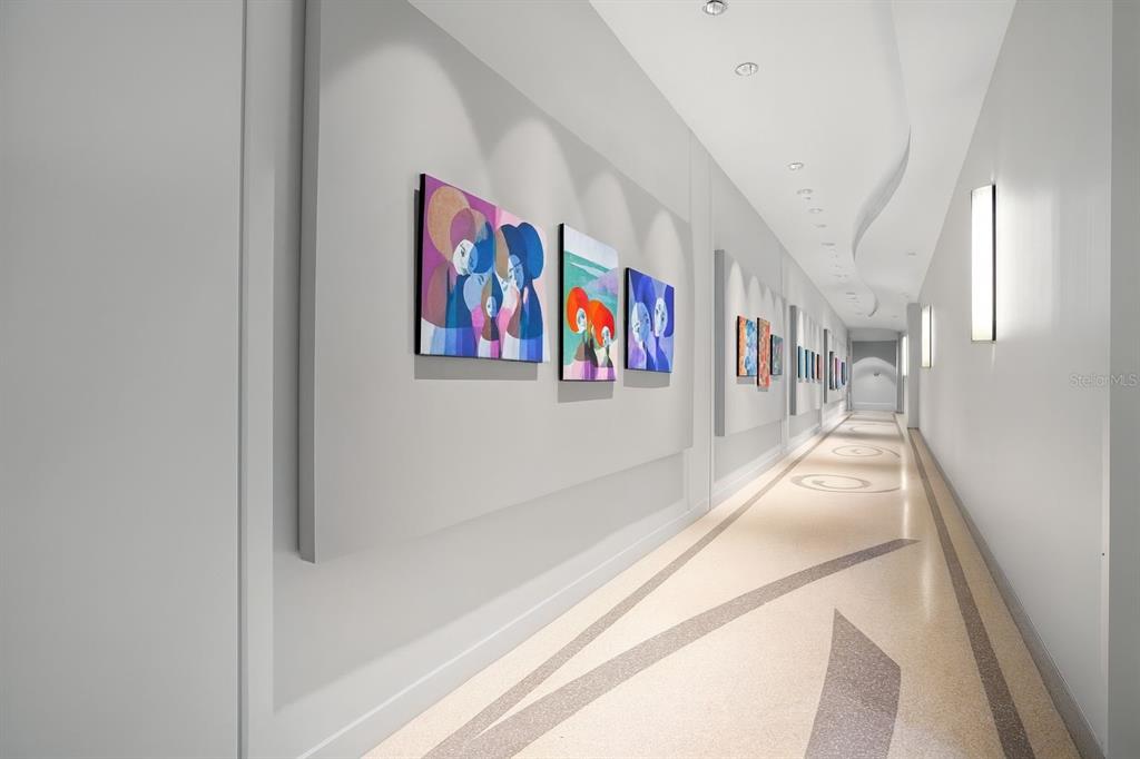 150 East Robinson Street, Unit 29B Orlando, FL 32801 - Photo 4 of 27 a view of a hallway with paintings on the wall