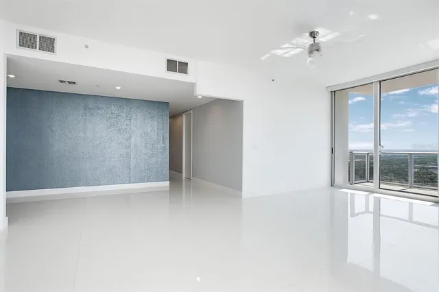 a view of an empty room with a window