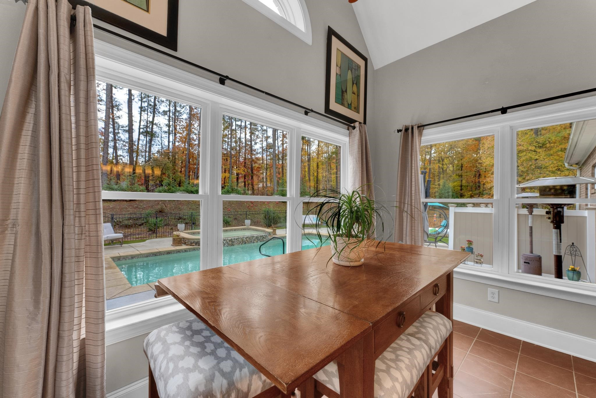 118 Citation Circle Durham, NC 27704 - Photo 54 of 67 a view of a dining room with furniture large windows and wooden floor