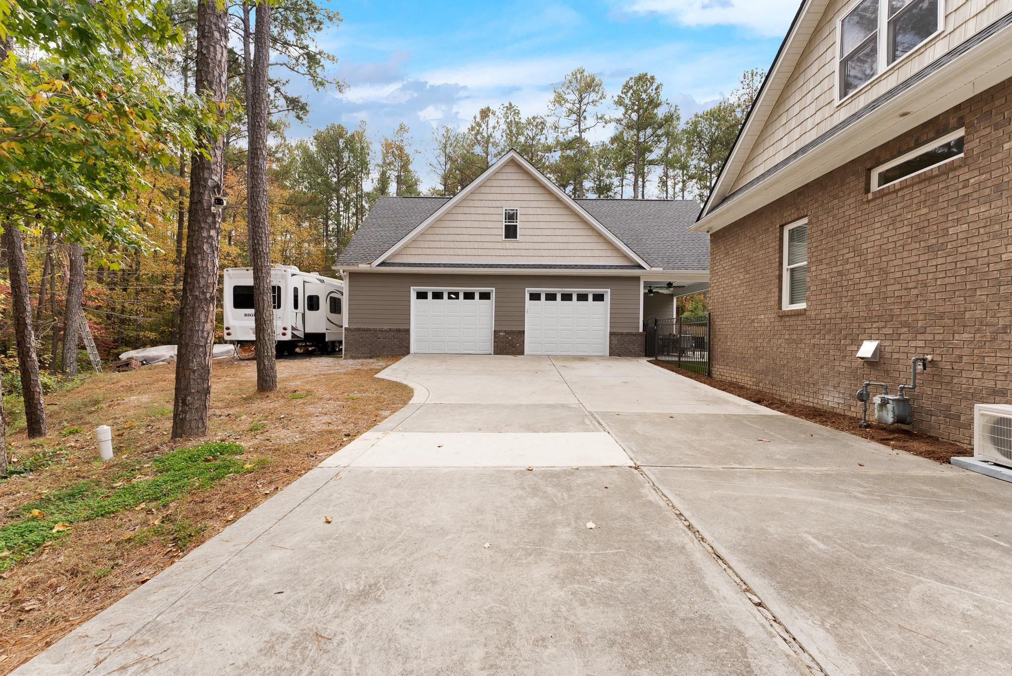 118 Citation Circle Durham, NC 27704 - Photo 57 of 67 a front view of a house with a yard and garage