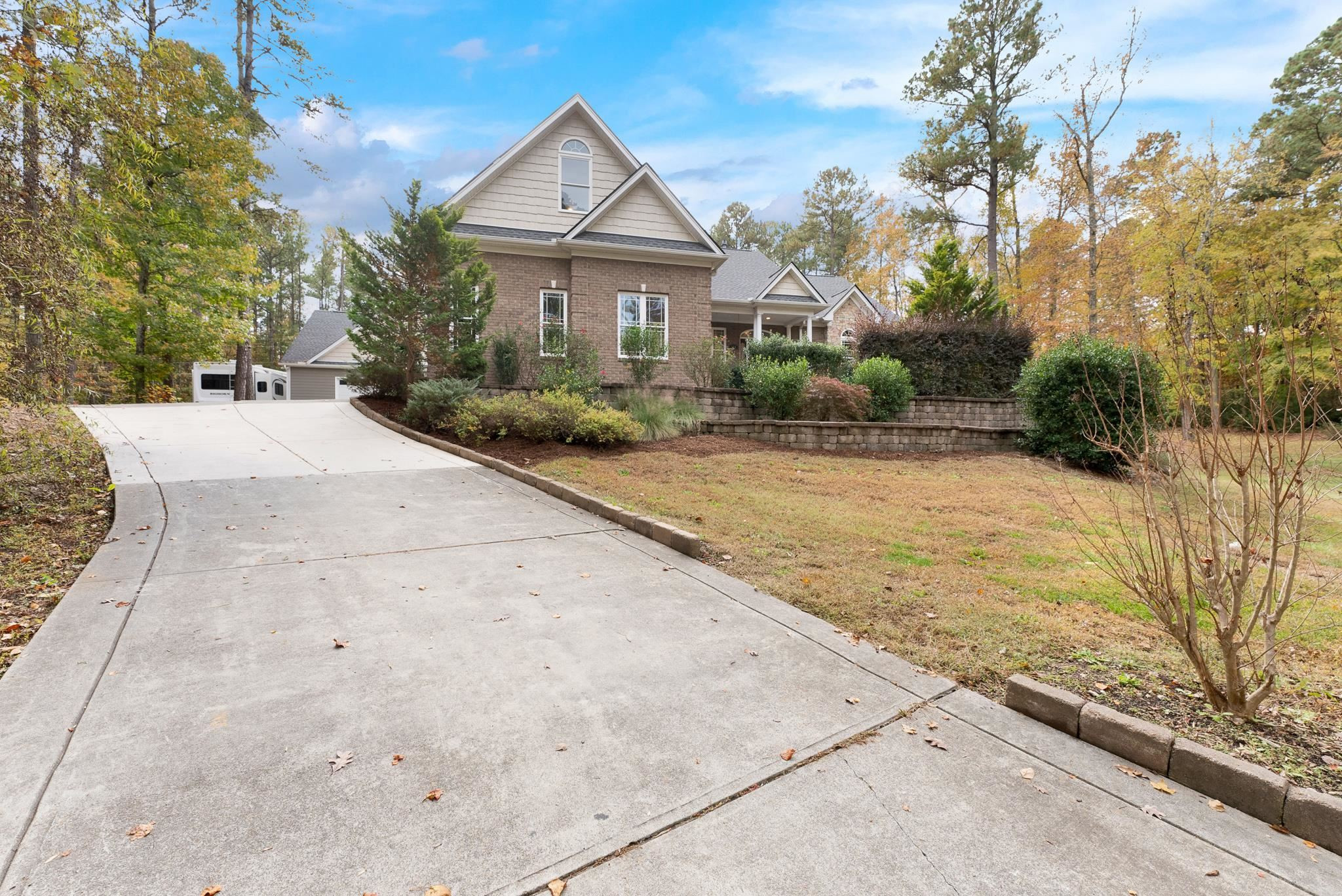 118 Citation Circle Durham, NC 27704 - Photo 59 of 67 a front view of a house with a yard and garage