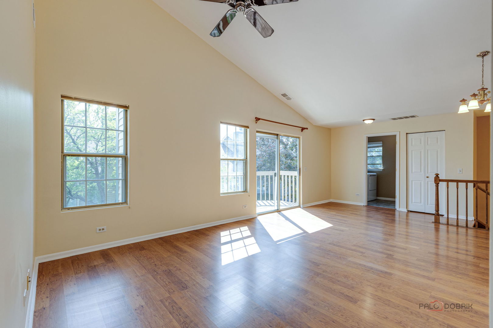 925 Ridgefield Lane Wheeling, IL 60090 - Photo 13 of 25 an empty room with wooden floor and windows