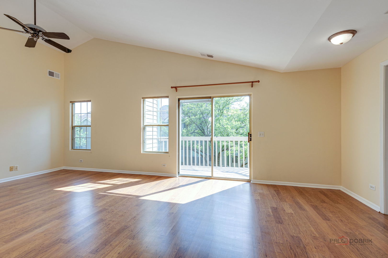 925 Ridgefield Lane Wheeling, IL 60090 - Photo 10 of 25 a view of an empty room with wooden floor and a window