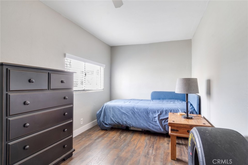 20970 Rider Street Perris, CA 92570 - Photo 24 of 29 a bedroom with a bed and a chair