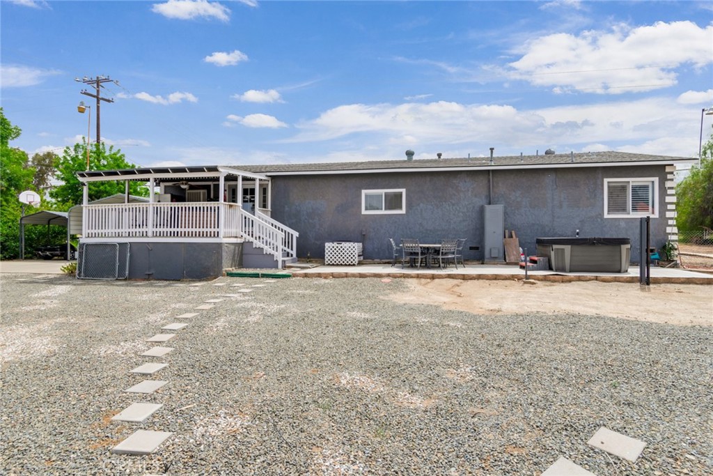 20970 Rider Street Perris, CA 92570 - Photo 27 of 29 a front view of a house with a yard and garage