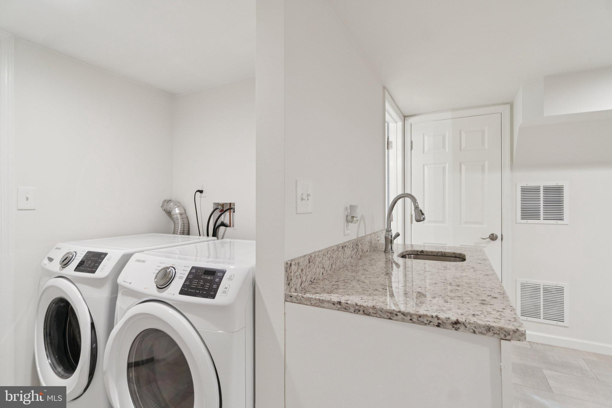 6216 5th Street Northwest Washington, DC 20011 - Photo 17 of 21 a utility room with sink dryer and washer