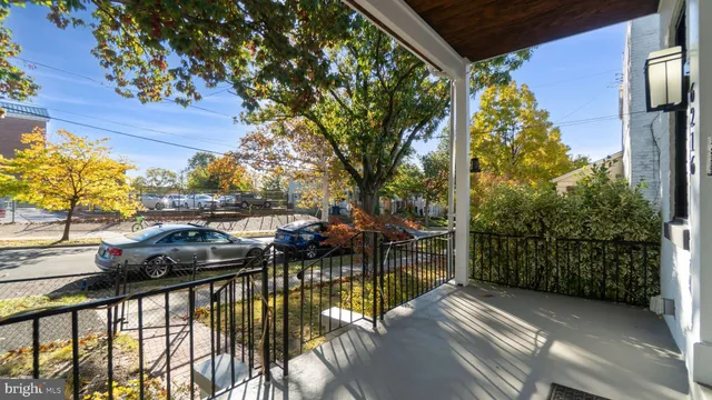 a view of a balcony with yard