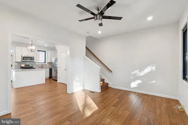 a view of an empty room and wooden floor