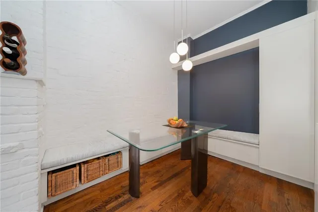 a view of staircase with a rug and a ceiling fan