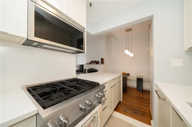 a kitchen with a stove and a microwave