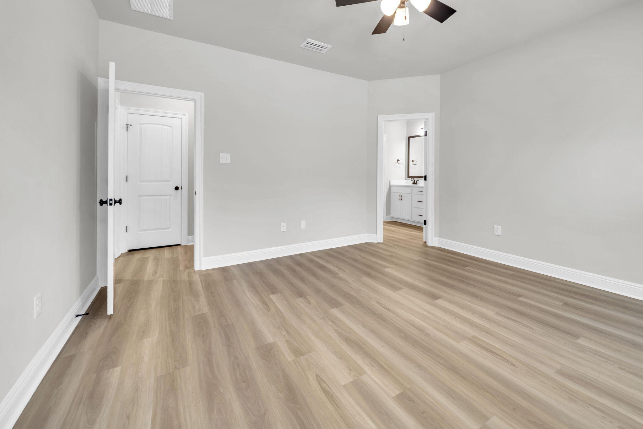 4603 Jayhawk Drive Crestview, FL 32539 - Photo 25 of 41 wooden floor in an empty room with a chandelier fan