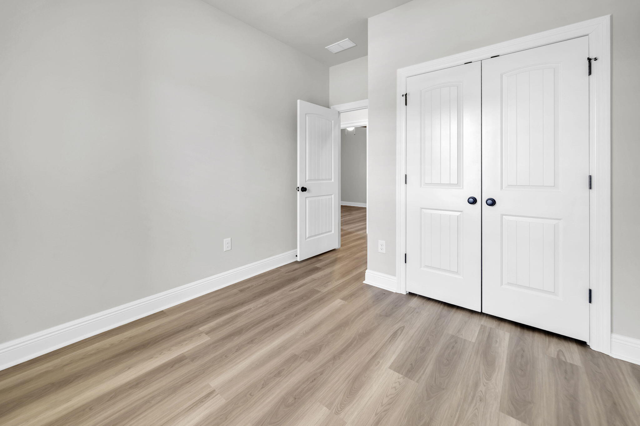 4603 Jayhawk Drive Crestview, FL 32539 - Photo 32 of 41 a view of an empty room with wooden floor