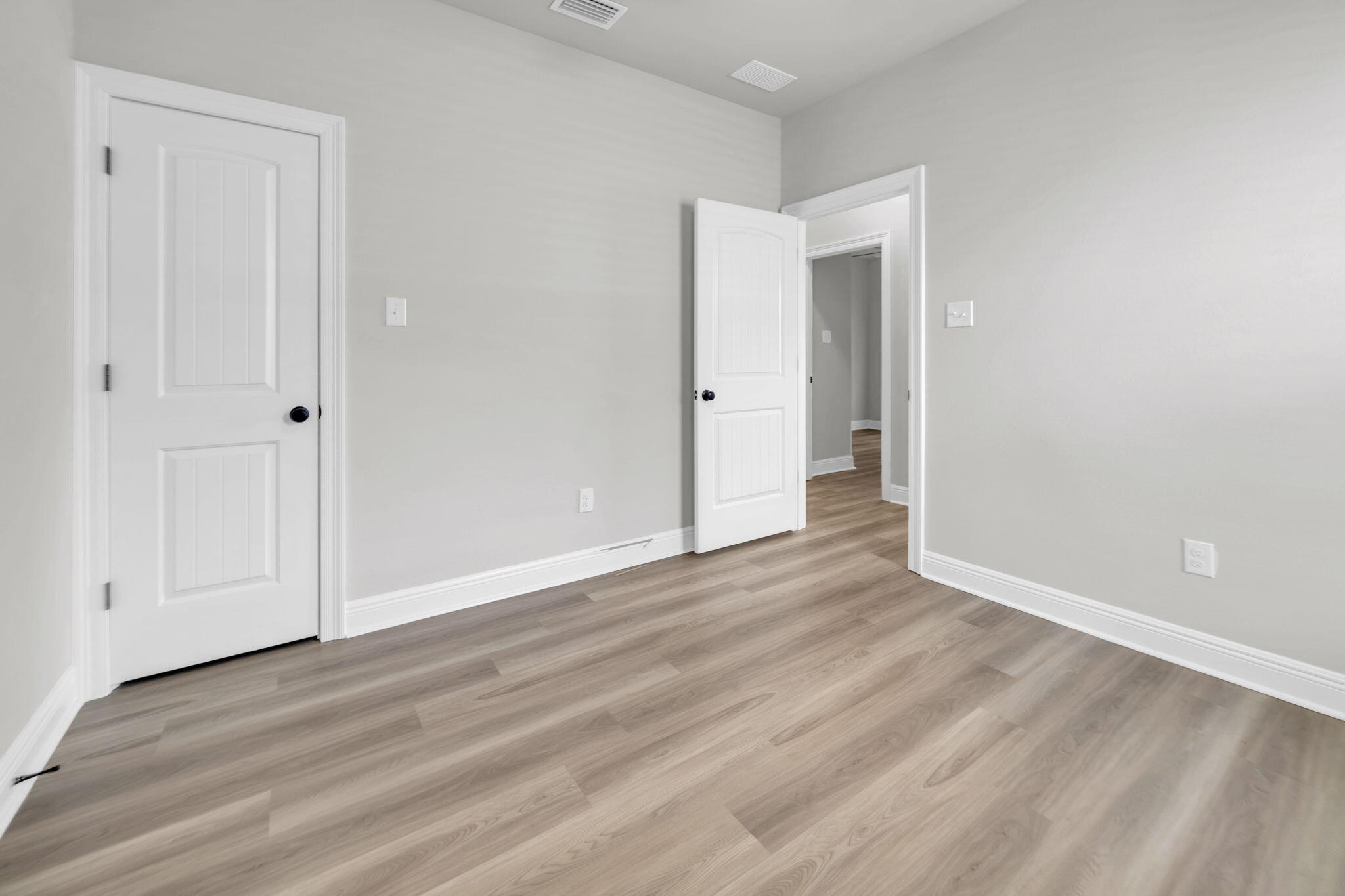 4603 Jayhawk Drive Crestview, FL 32539 - Photo 34 of 41 a view of an empty room and wooden floor