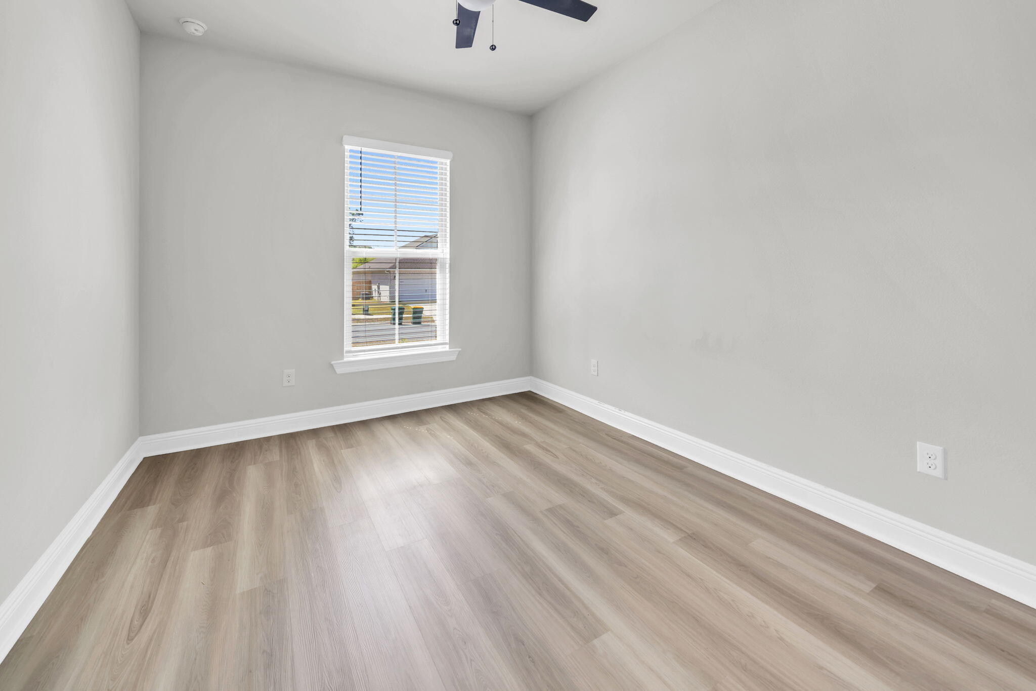 4603 Jayhawk Drive Crestview, FL 32539 - Photo 35 of 41 wooden floor in an empty room with a window