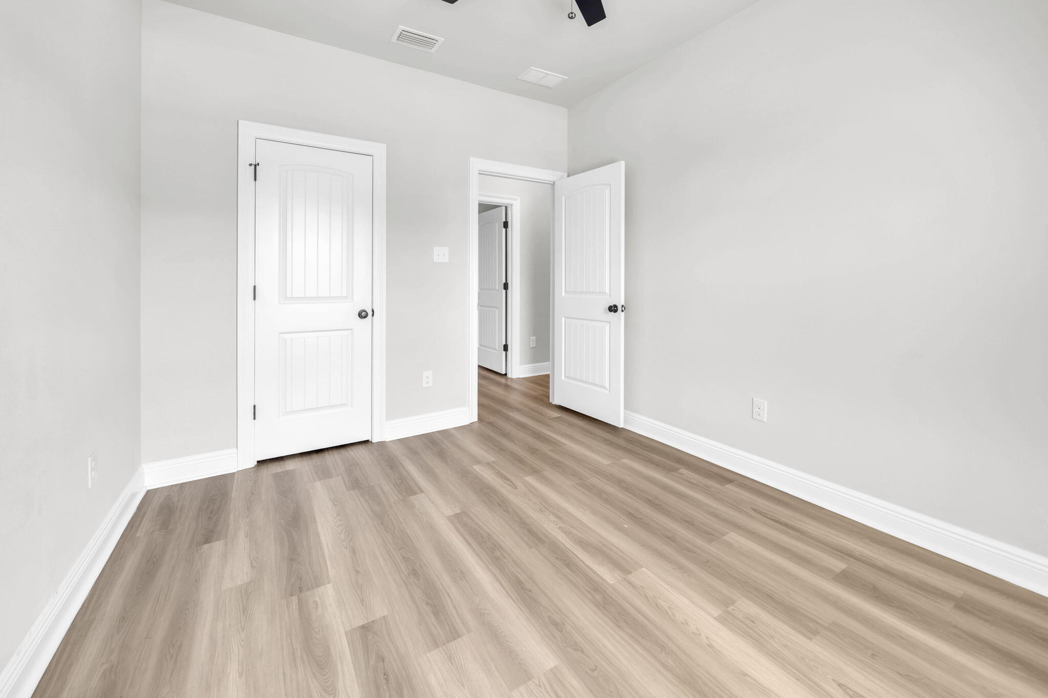 4603 Jayhawk Drive Crestview, FL 32539 - Photo 36 of 41 a view of an empty room and wooden floor