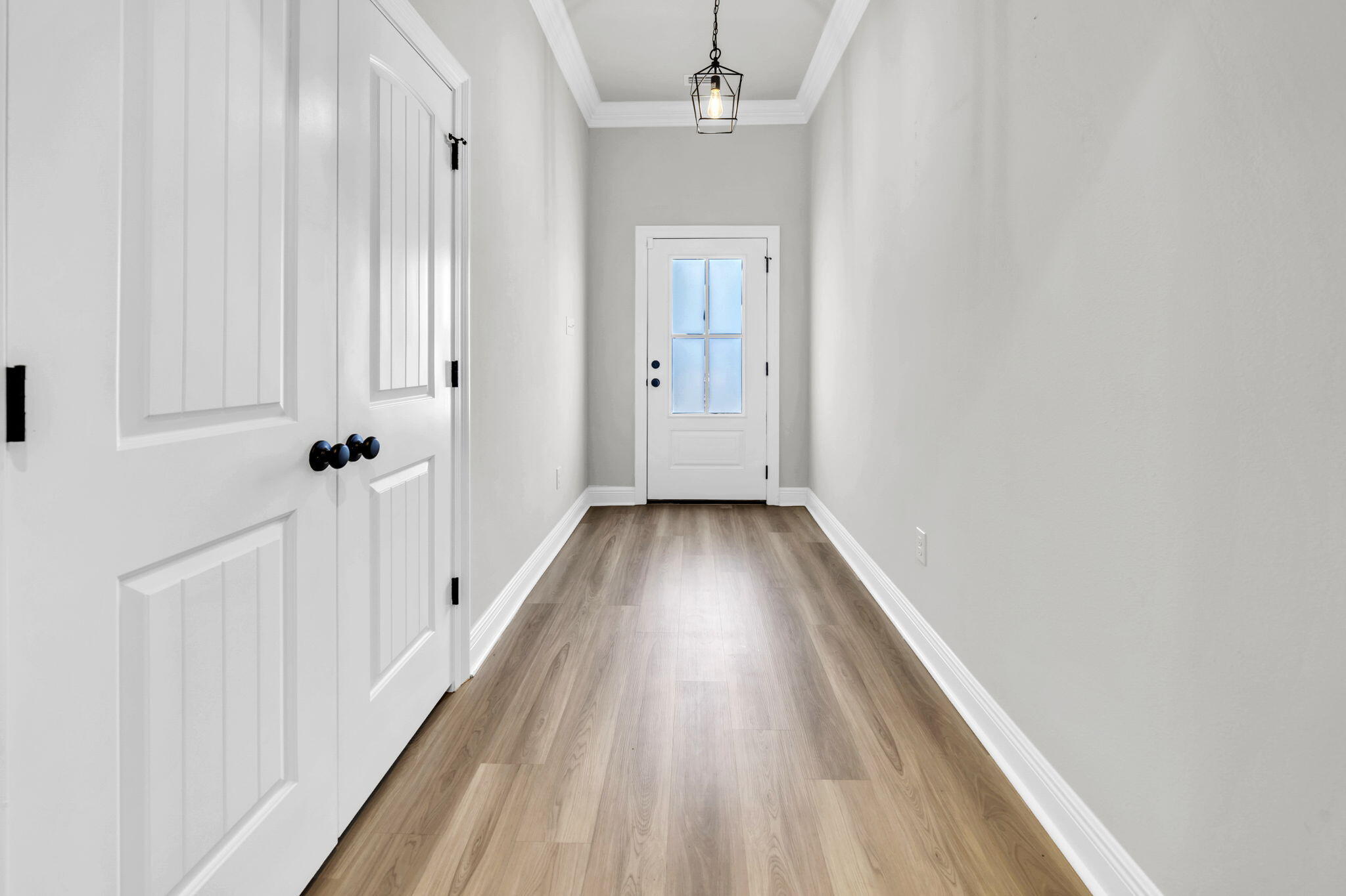 4603 Jayhawk Drive Crestview, FL 32539 - Photo 8 of 41 a view of a hallway with wooden floor and staircase