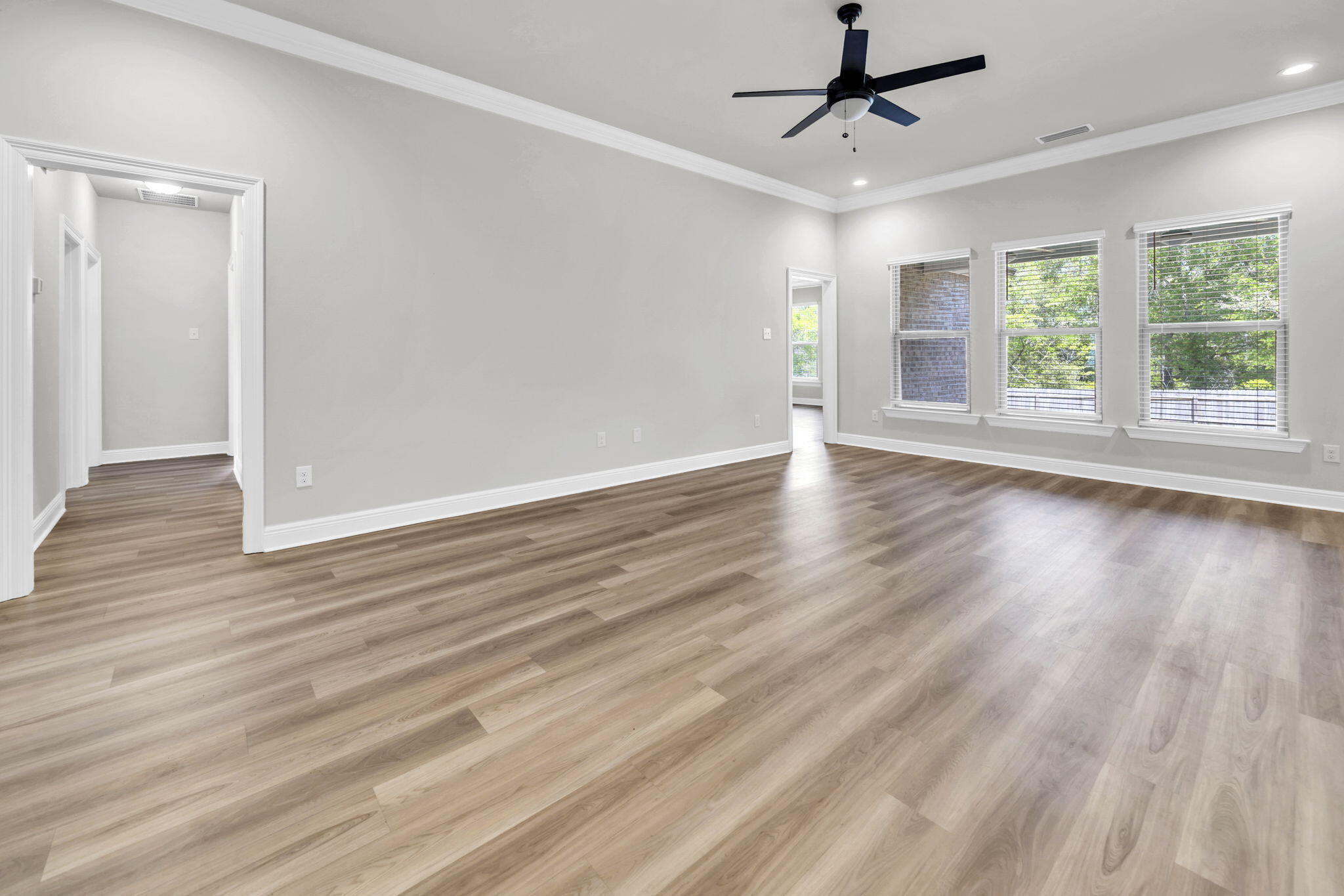 4603 Jayhawk Drive Crestview, FL 32539 - Photo 10 of 41 wooden floor in an empty room with a window