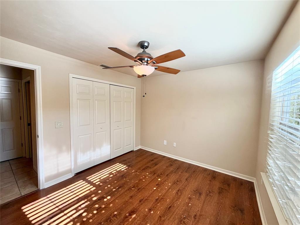 6508 Northwest 109th Place Alachua, FL 32615 - Photo 17 of 24 an empty room with fan and windows