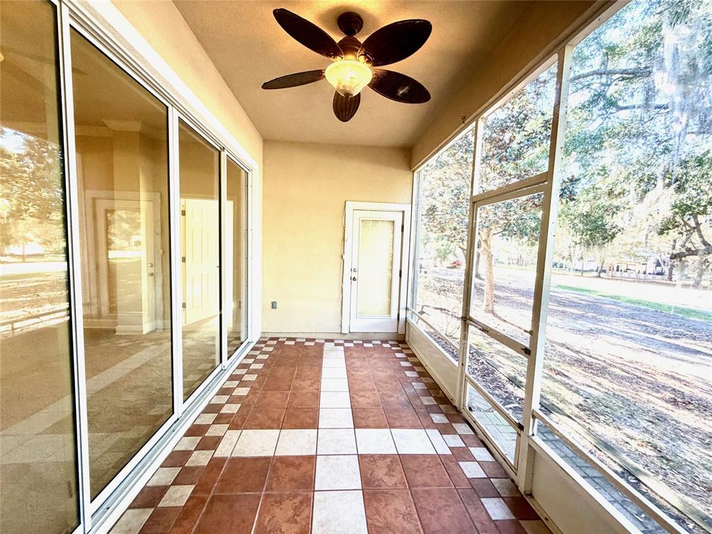 6508 Northwest 109th Place Alachua, FL 32615 - Photo 19 of 24 a view of bathroom with a floor to ceiling window and a ceiling fan
