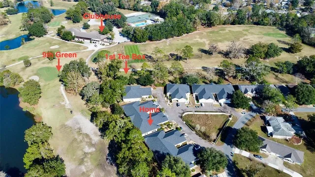 an aerial view of a house with yard