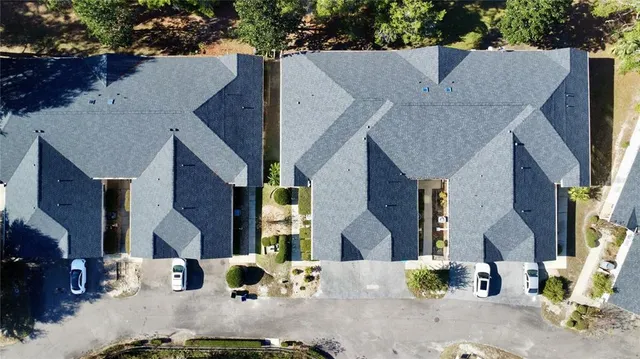 a view of multiple houses with a street