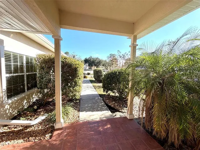 a view of a back yard from a balcony