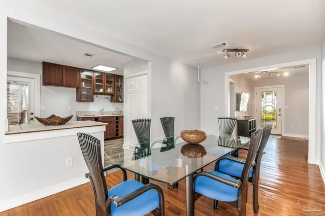 a kitchen with stainless steel appliances granite countertop a stove a sink and a microwave oven