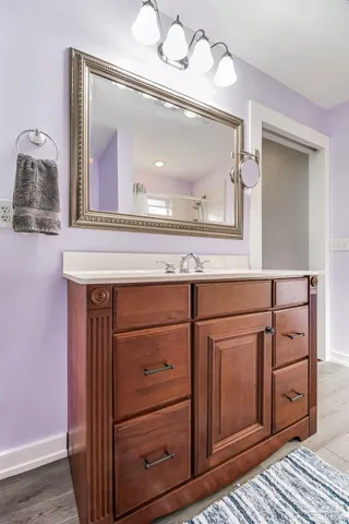 a view of a patio with table and chairs and wooden floor