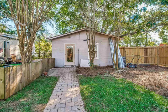 a view of a patio with table and chairs and wooden floor