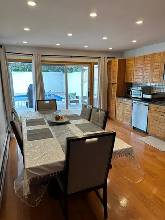 a living room with kitchen island furniture and a large window
