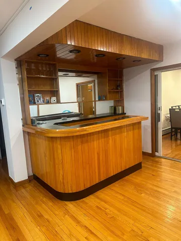 a view of a living room with kitchen island