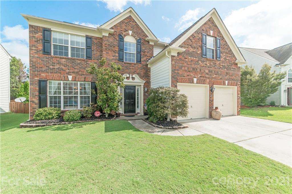 2605 Stirrup Ridge Lane Charlotte, NC 28270 - Photo 1 of 27 a front view of house with yard and outdoor seating