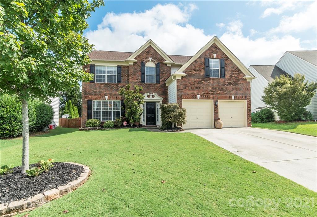 2605 Stirrup Ridge Lane Charlotte, NC 28270 - Photo 2 of 27 a front view of a house with a yard