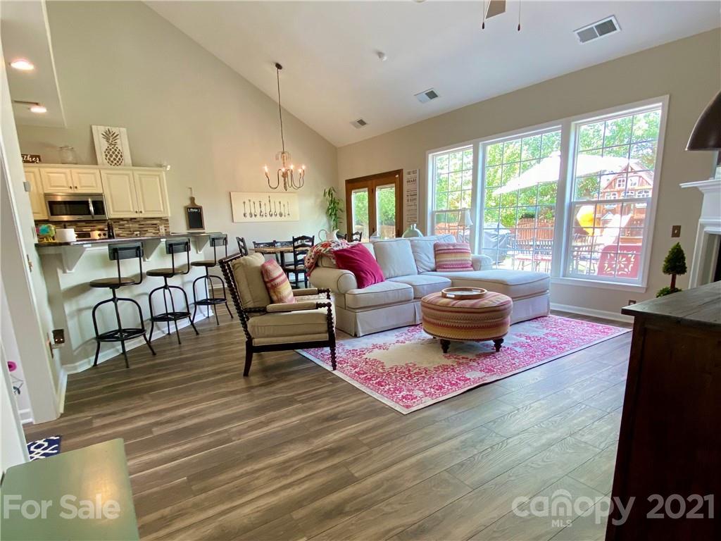 2605 Stirrup Ridge Lane Charlotte, NC 28270 - Photo 14 of 27 a living room with furniture a rug and a floor to ceiling window