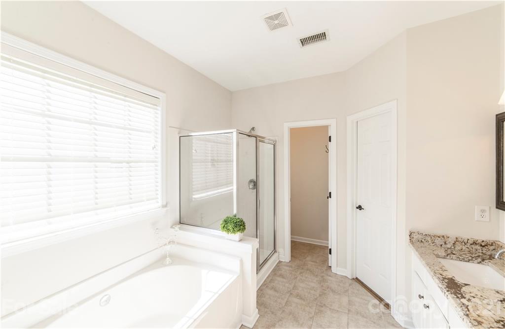 2605 Stirrup Ridge Lane Charlotte, NC 28270 - Photo 16 of 27 a spacious bathroom with a tub shower and sink