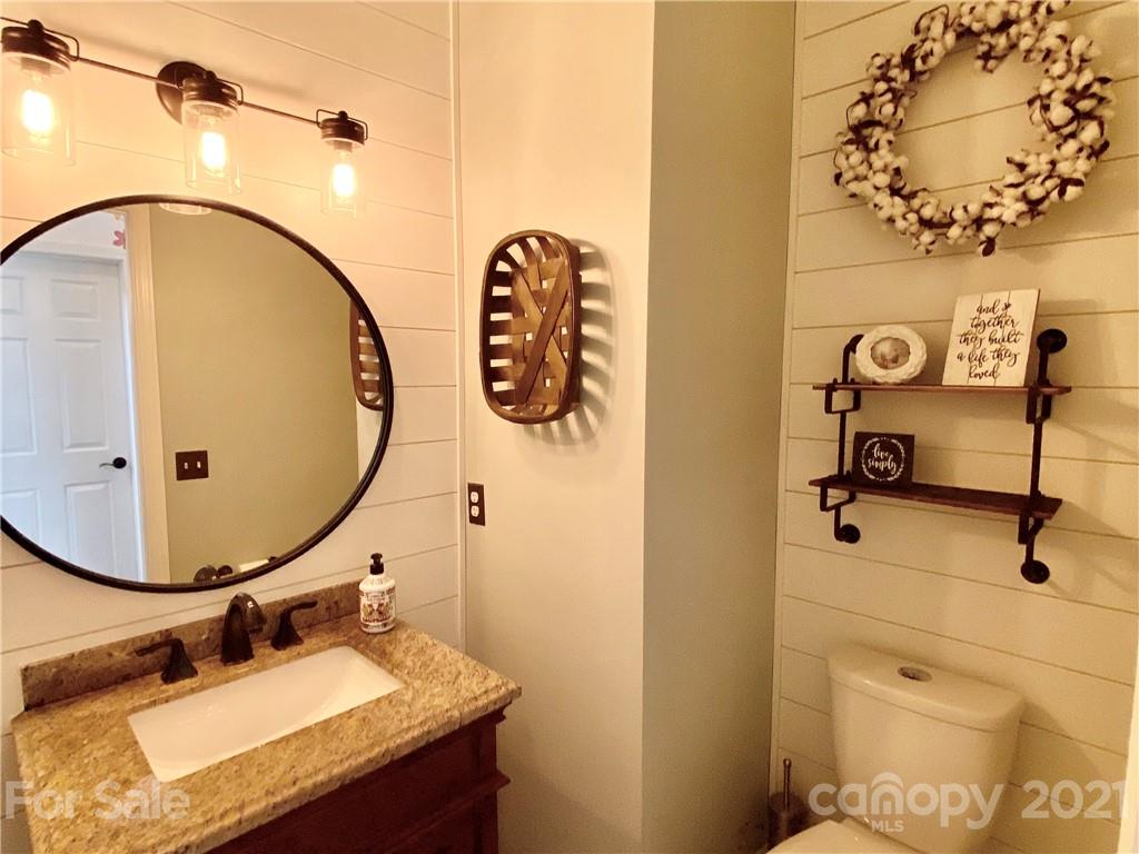 2605 Stirrup Ridge Lane Charlotte, NC 28270 - Photo 17 of 27 a bathroom with a sink and mirror