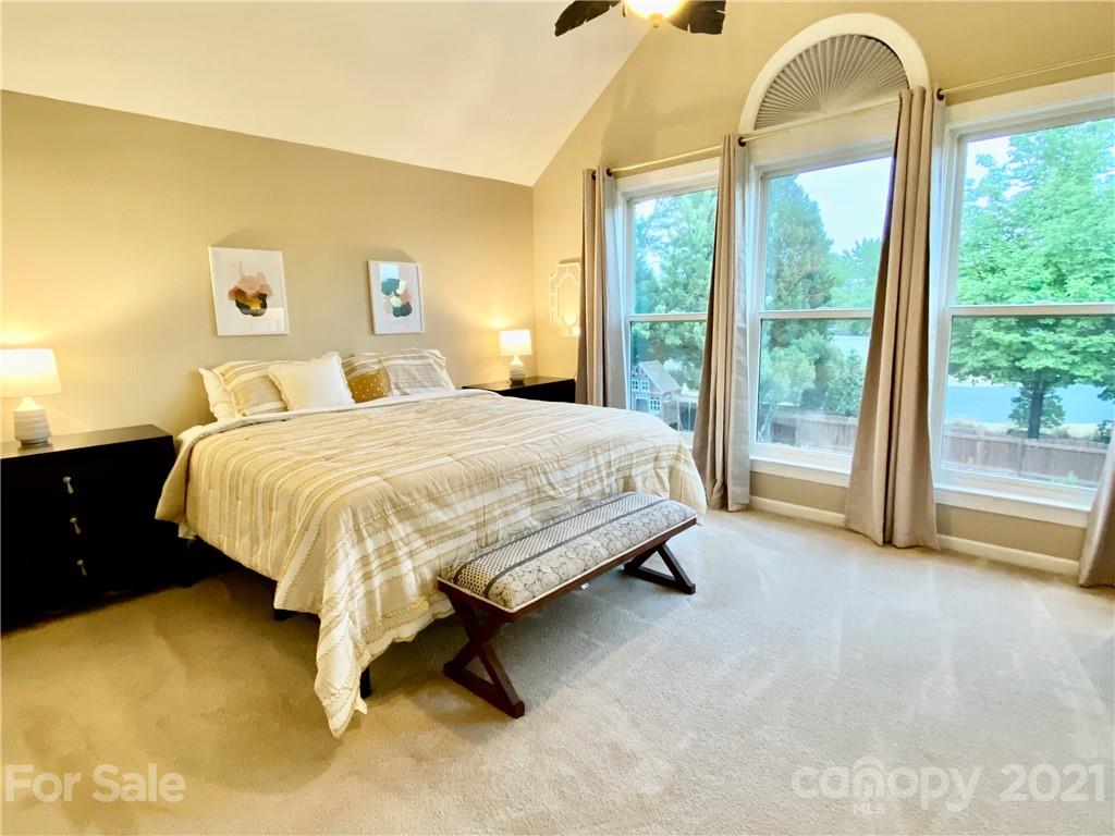 2605 Stirrup Ridge Lane Charlotte, NC 28270 - Photo 20 of 27 a bedroom with a bed and a dresser next to a window