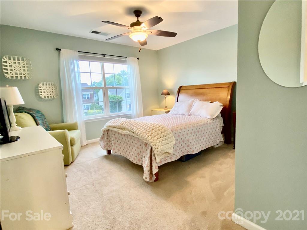 2605 Stirrup Ridge Lane Charlotte, NC 28270 - Photo 21 of 27 a bed sitting in a bedroom next to a window
