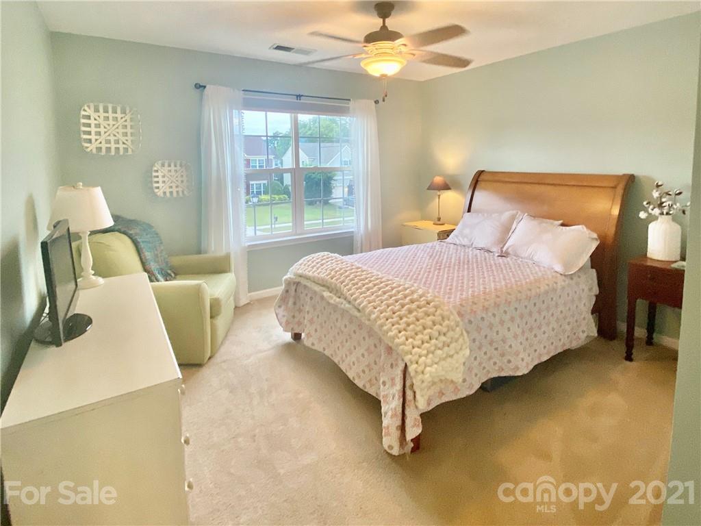 2605 Stirrup Ridge Lane Charlotte, NC 28270 - Photo 22 of 27 a bedroom with a bed and wooden floor