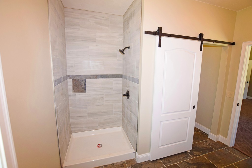 70 New Salem Road Petersham, MA 01366 - Photo 13 of 22 a bathroom with a glass shower door