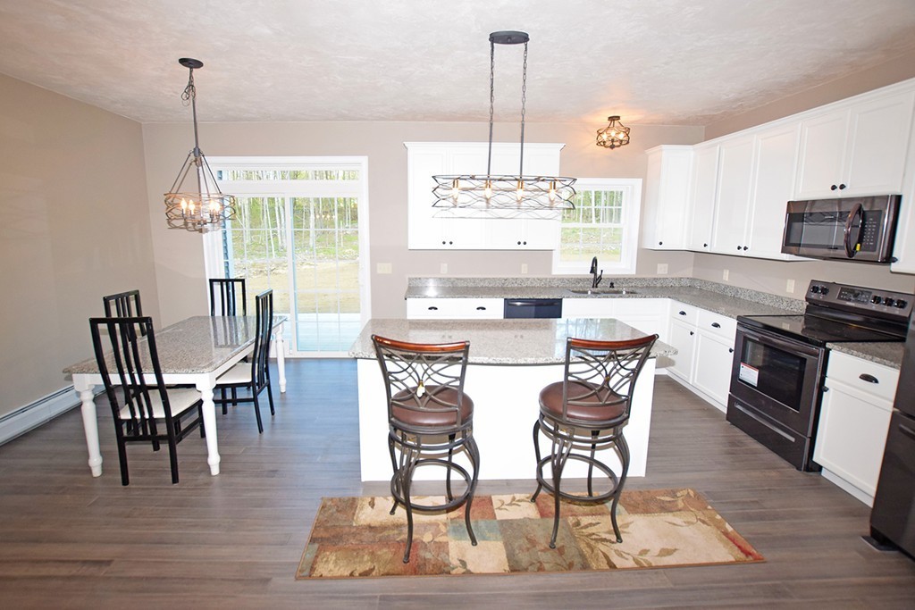 70 New Salem Road Petersham, MA 01366 - Photo 5 of 22 a view of a dining room with furniture window and wooden floor