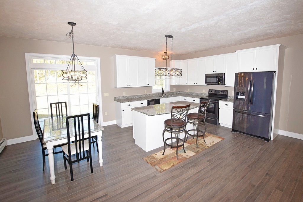 70 New Salem Road Petersham, MA 01366 - Photo 6 of 22 a view of a dining room with furniture window and wooden floor