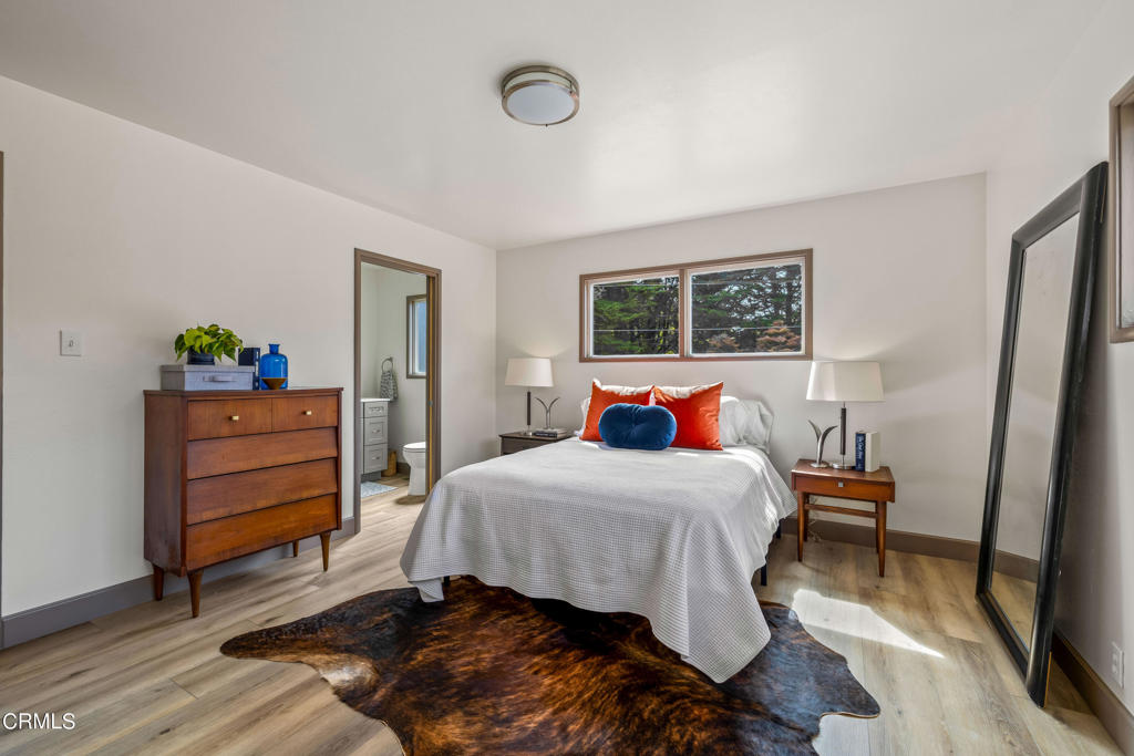 18601 Cypress Road Fort Bragg, CA 95437 - Photo 18 of 35 a bedroom with a bed and wooden floor