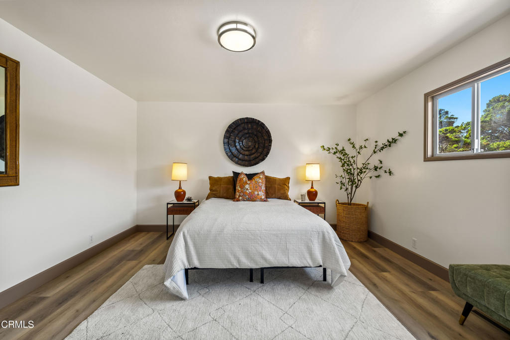 18601 Cypress Road Fort Bragg, CA 95437 - Photo 23 of 35 a bedroom with a bed and a lamp on dresser