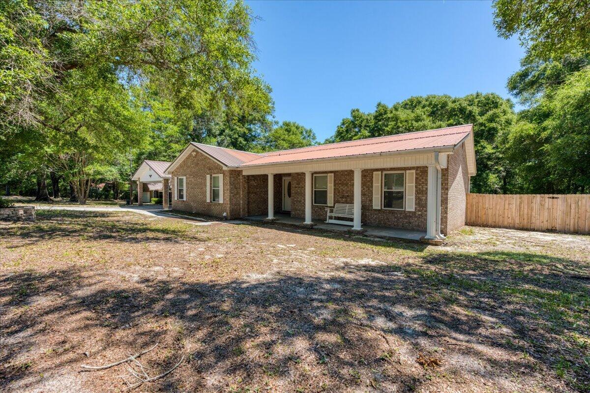 210 Shell Drive Crestview, FL 32536 - Photo 7 of 67 a house with yard in front of it