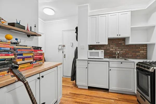 a kitchen with stainless steel appliances cabinets a sink and a stove