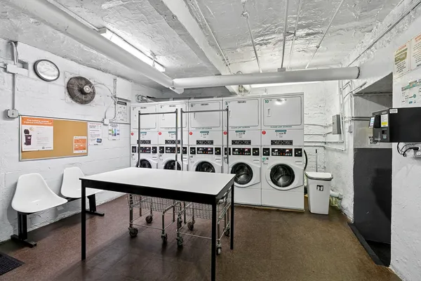 a kitchen with a table chairs and a stove top oven